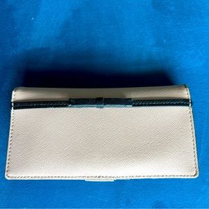 Kate Spade wallet baby Pink with black bow.